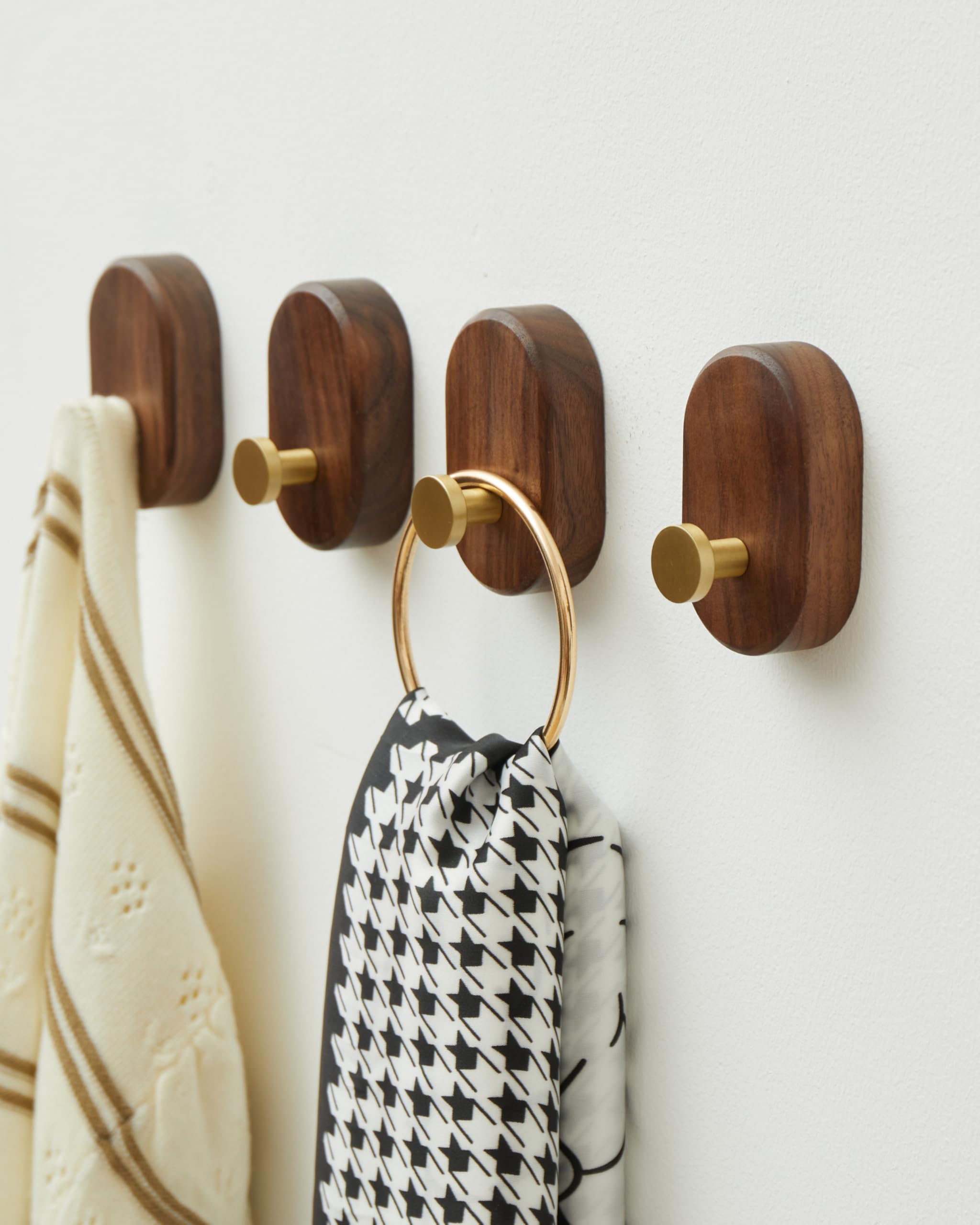 4-pack wall-mounted hooks shown on wall for organized entryway.