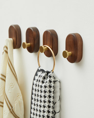 4-pack wall-mounted hooks shown on wall for organized entryway.