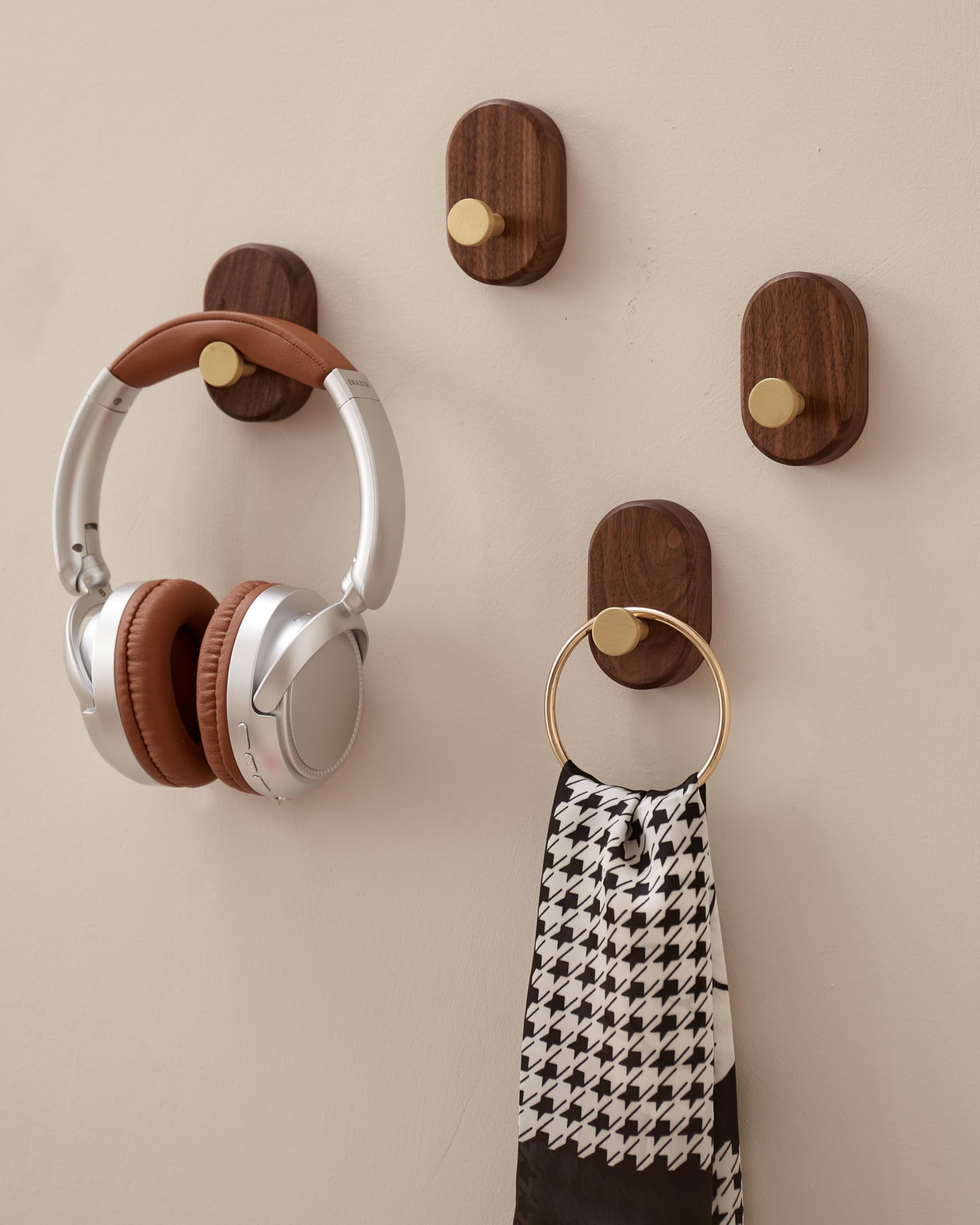 Close-up of brass accent on a wood coat hook for sturdy performance.