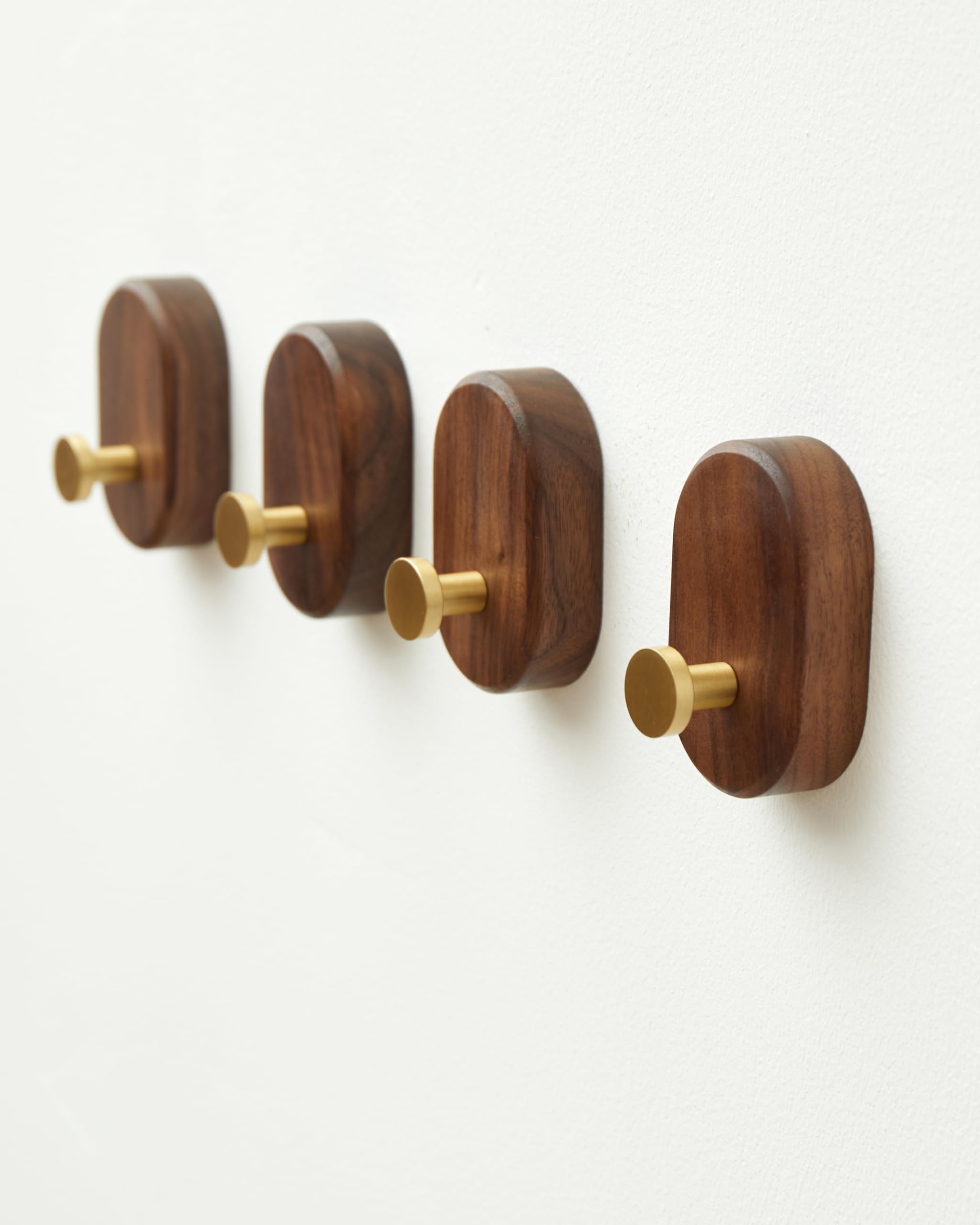 Vinoil wood coat hook wall mount with walnut and bronze detail, built for daily use.