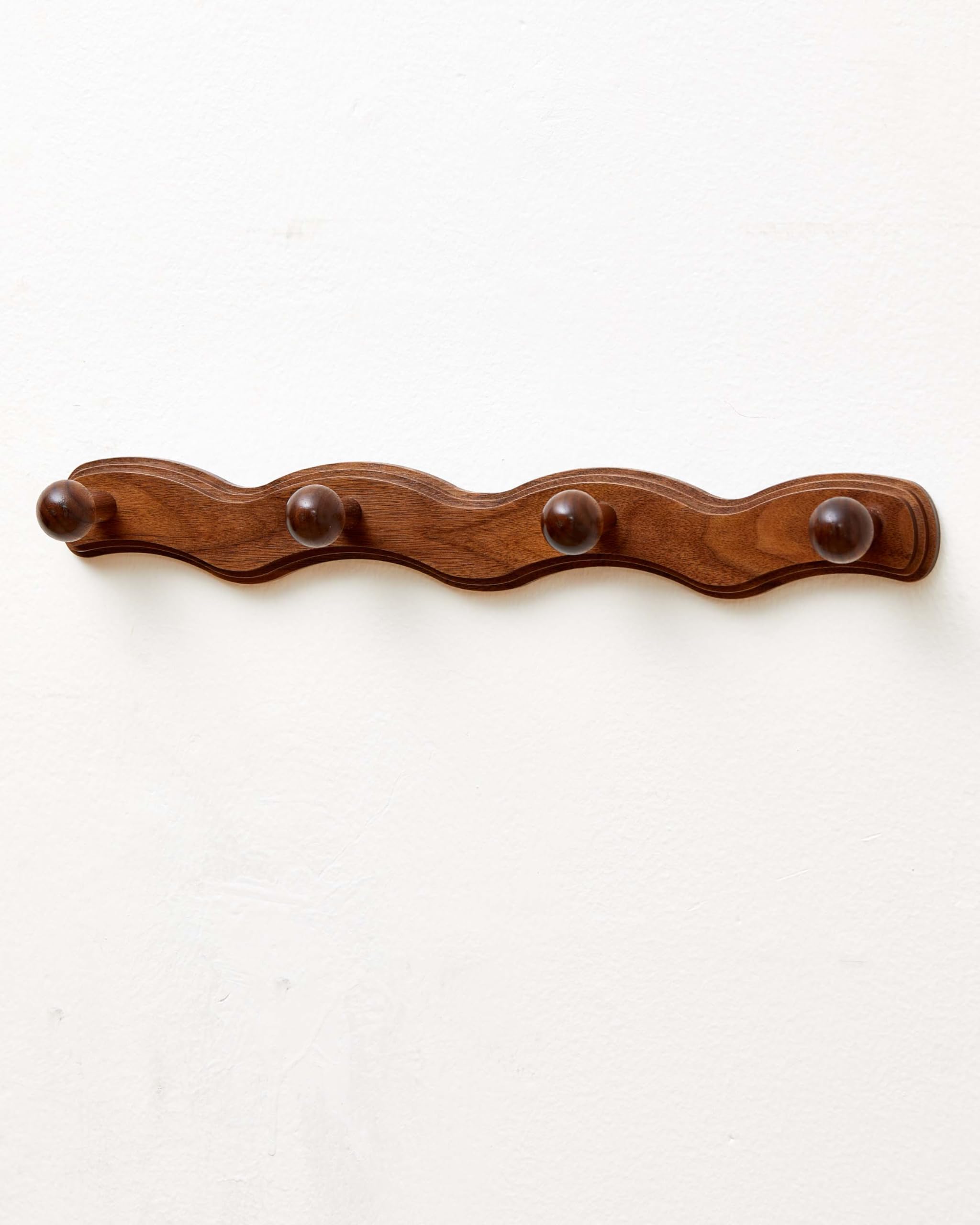 Vinoil wall-mounted walnut coat rack adds elegant entryway storage