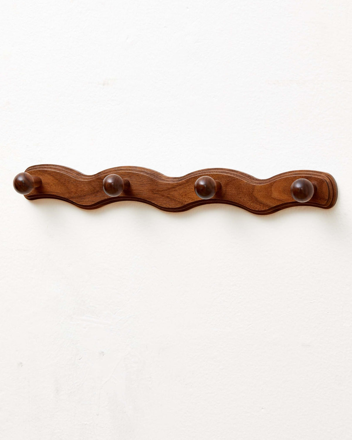 Vinoil wall-mounted walnut coat rack adds elegant entryway storage