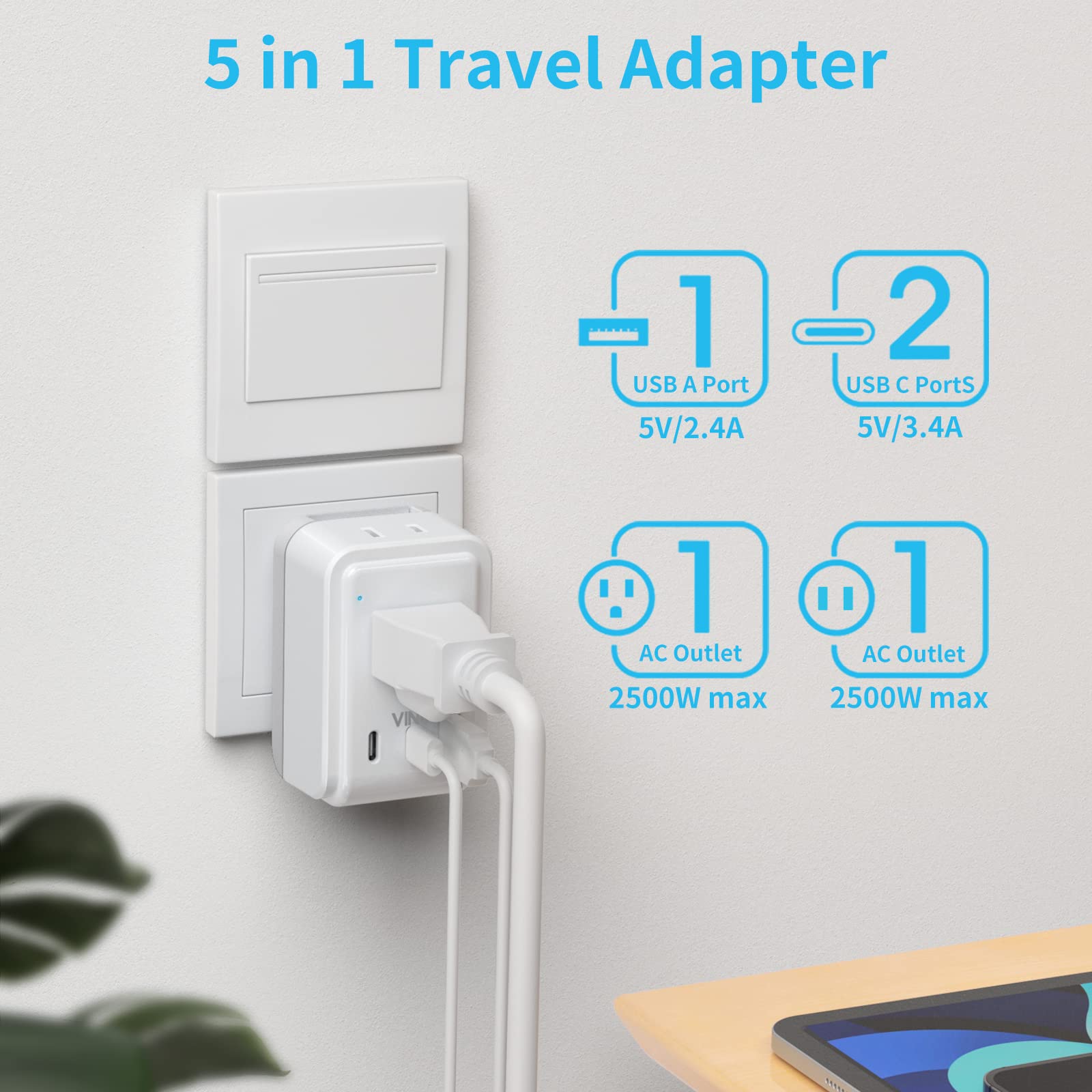 VINTAR travel plug adapter held in hand, showcasing its compact size.