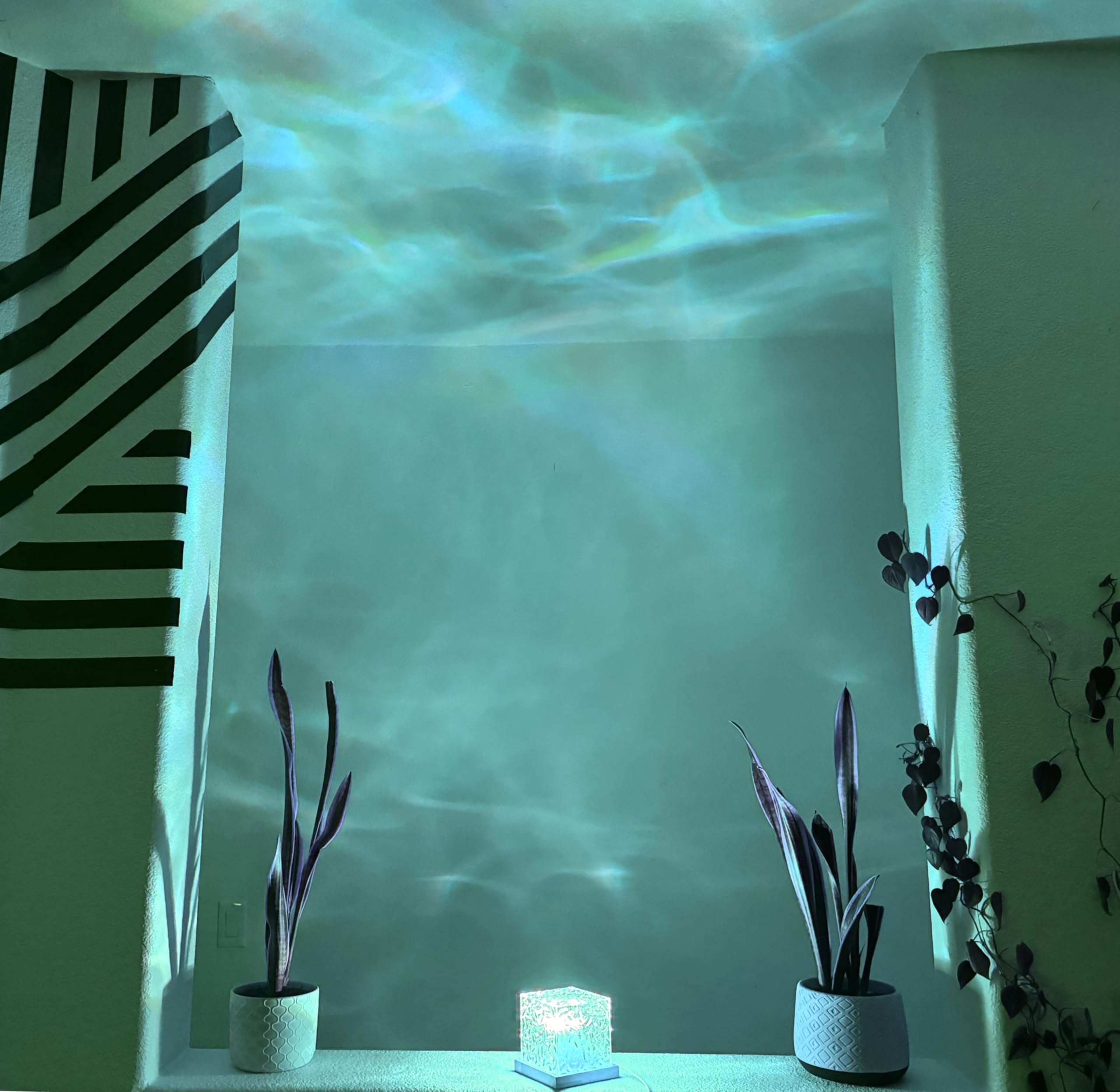 Vita Ocean Wave Light Projector remote control simplifies customization.