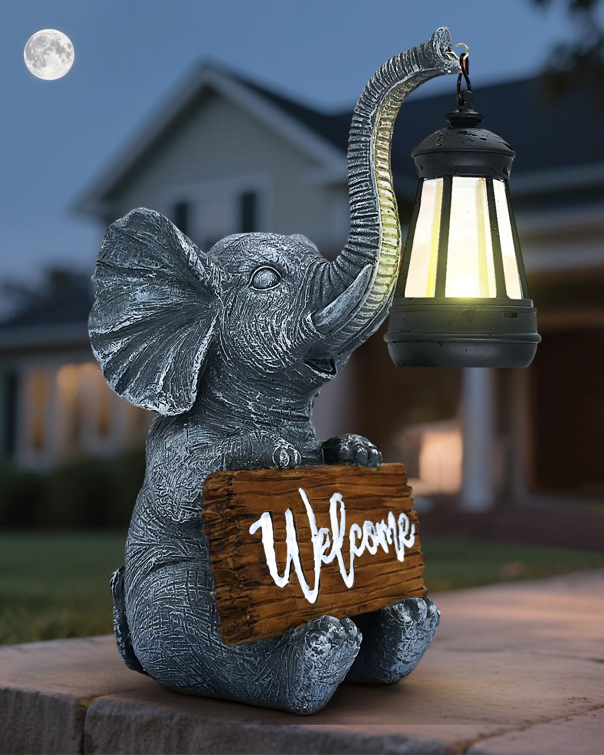 VMANYFIRE outdoor elephant statue solar light brightens night garden paths.