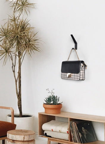 VOROMADU Minimalist double hook highlights space-saving organization for busy rooms.