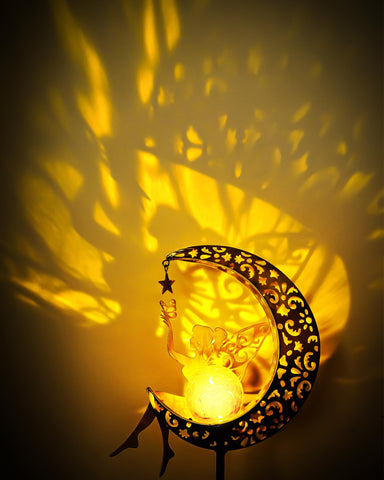 Vuees solar garden statue star light creates whimsical yard accents.