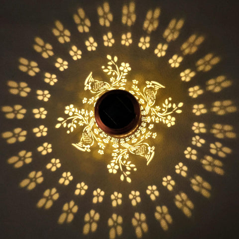 WACLSTDAY Cardinal Solar Lantern hanging on a wall creates warm outdoor ambience.