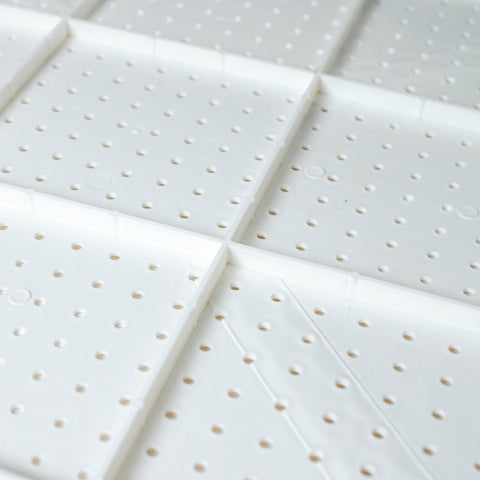 WallPeg pegboard features 12 flush mounting holes