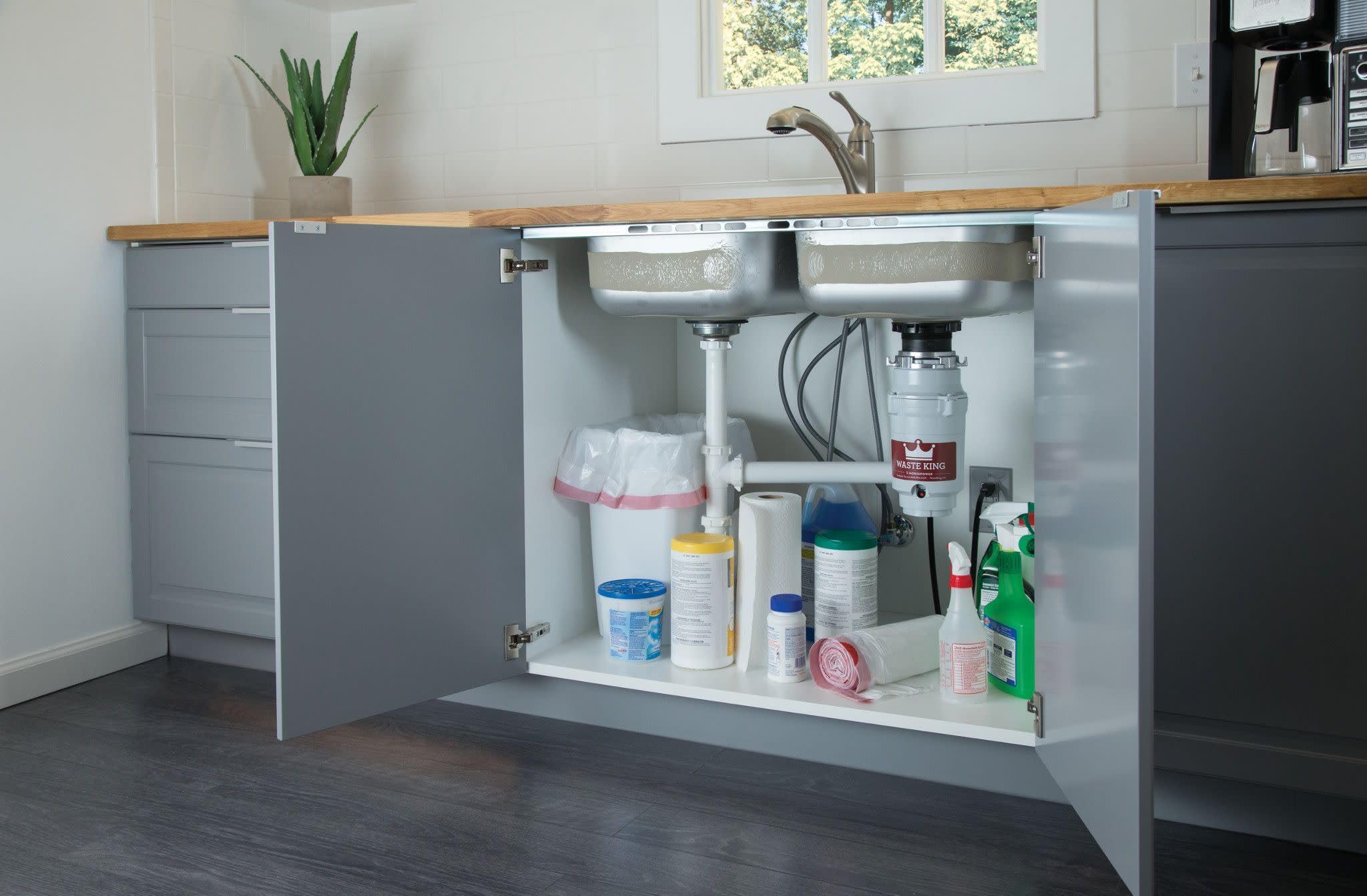 Removable splashguard on Waste King L-111 allows easy cleaning and maintenance