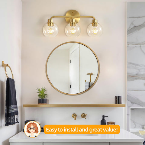 Watyo gold vanity light with clear globe glass shades adds glamorous ambience