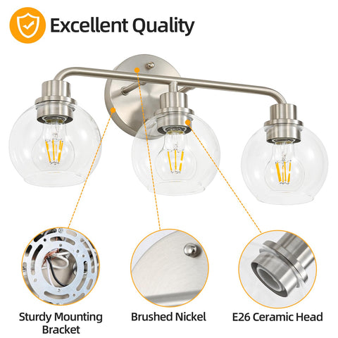 Watyo vanity light with clear globe glass shades for stylish bathroom ambience.