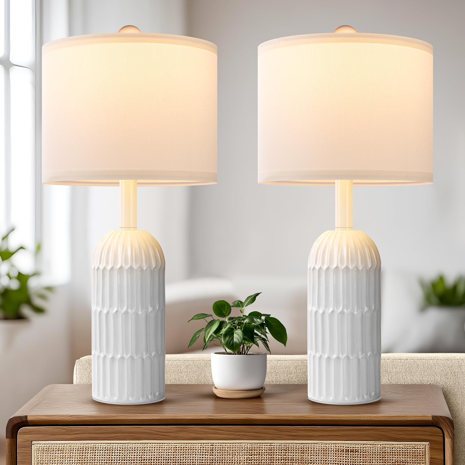 Weddeg two-pack white table lamps on a nightstand provide balanced bedside lighting.