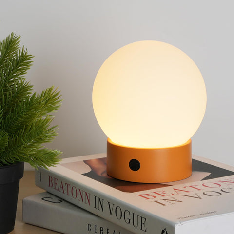 WEILAILUX orange globe lamp provides soft ambient glow for cozy evenings.