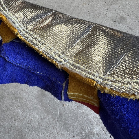 Fiberglass layer supports high spatter welding for durable protection