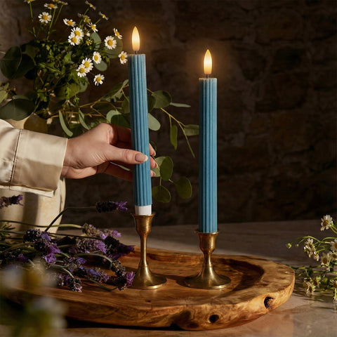 West Ivory blue fluted taper candle with grooved design for elegant table decor.