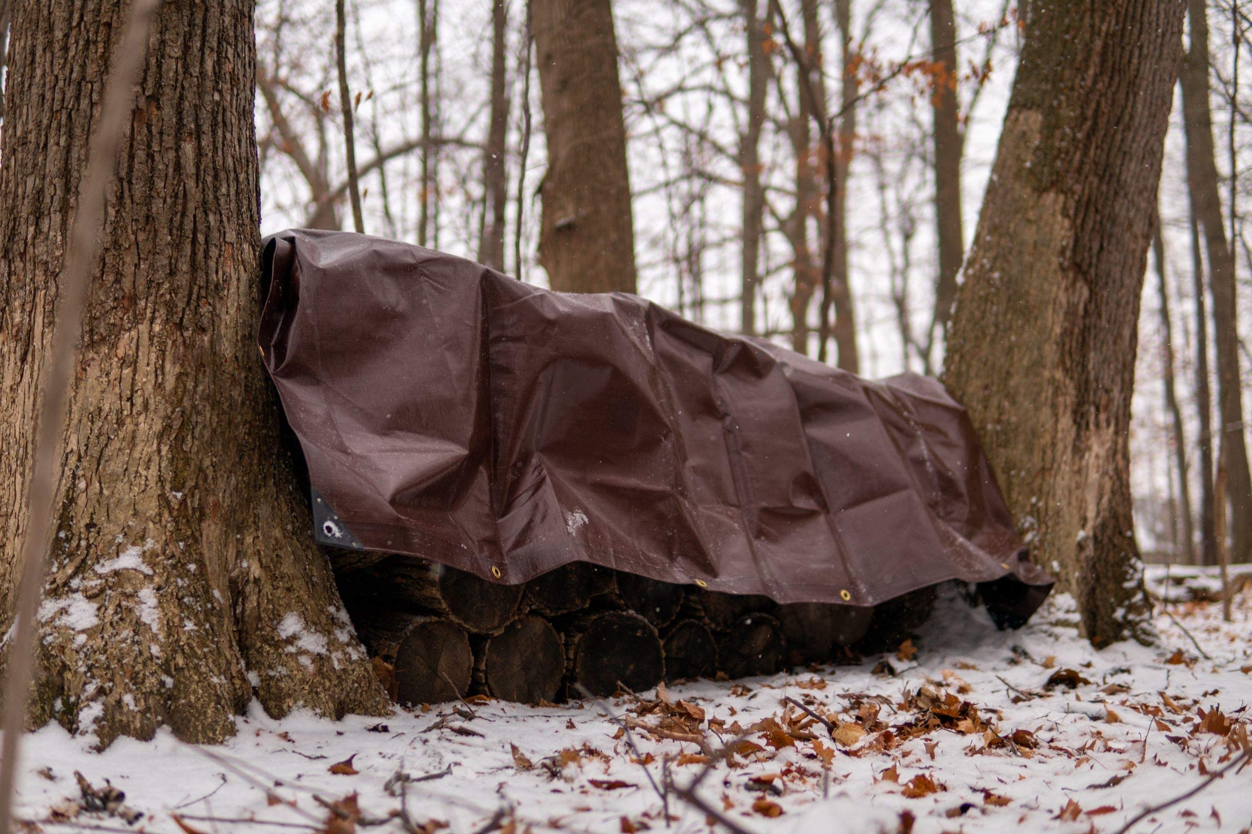 WHITEDUCK tarp camping setup shows shelter and ground-cover versatility.