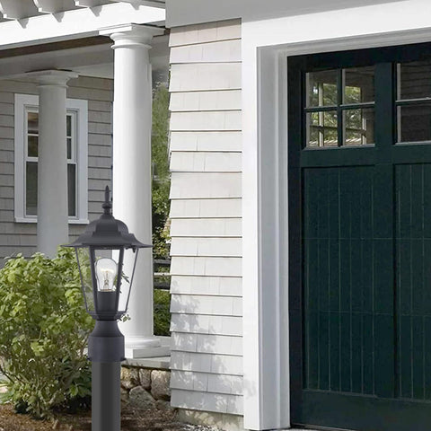Wisbeam black post light enhances curb appeal at dusk and after sunset.