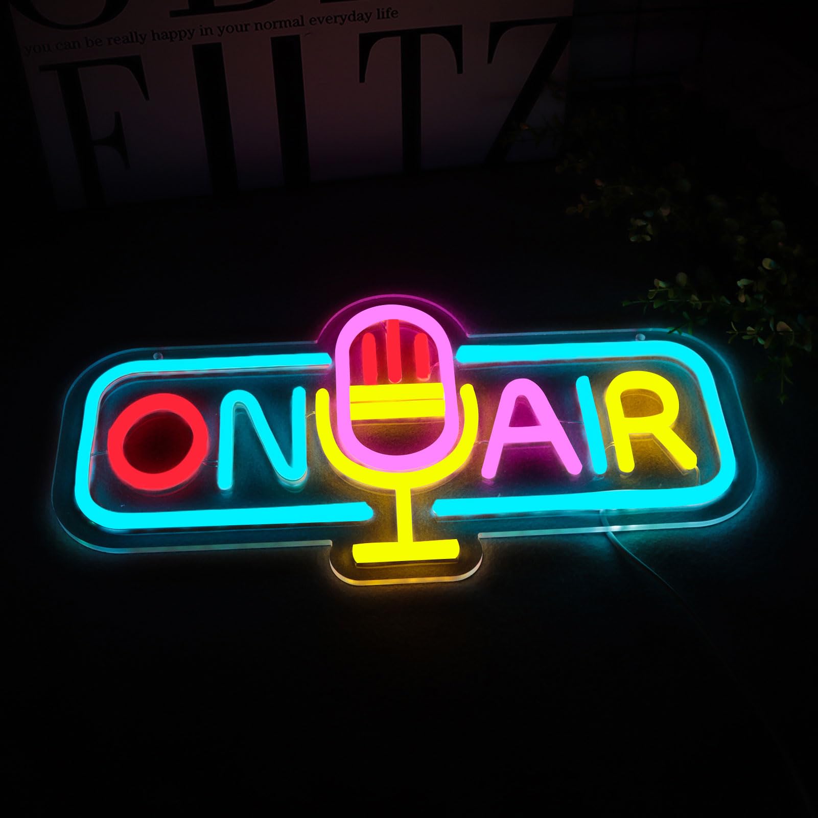 WittyRhE On Air neon sign adds room ambience in a creative workspace