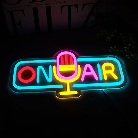 WittyRhE On Air neon sign adds room ambience in a creative workspace