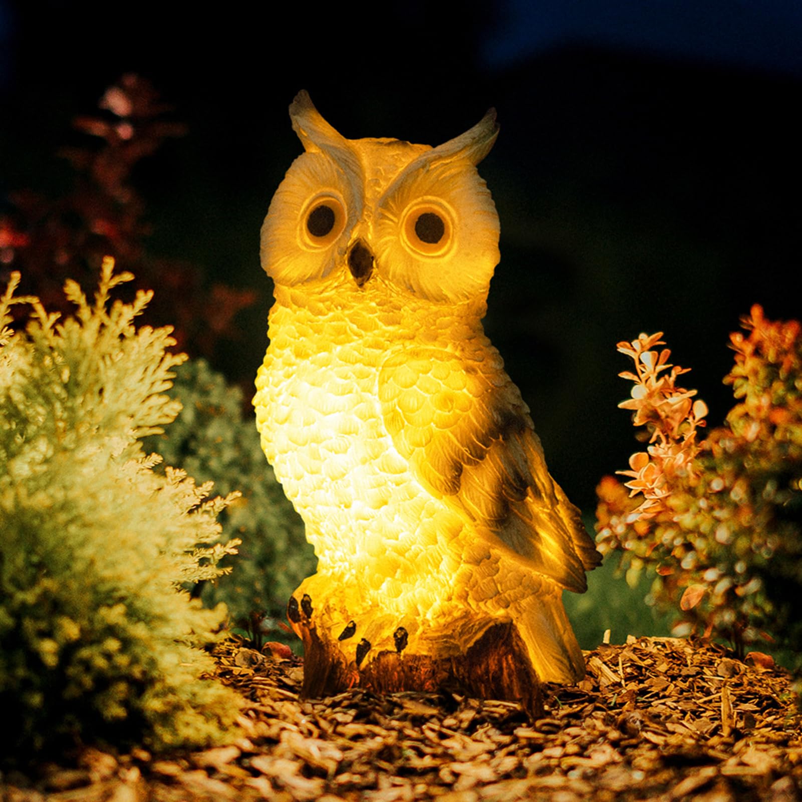 WONDHOME solar owl garden statue glowing softly in sunlight for outdoor charm.