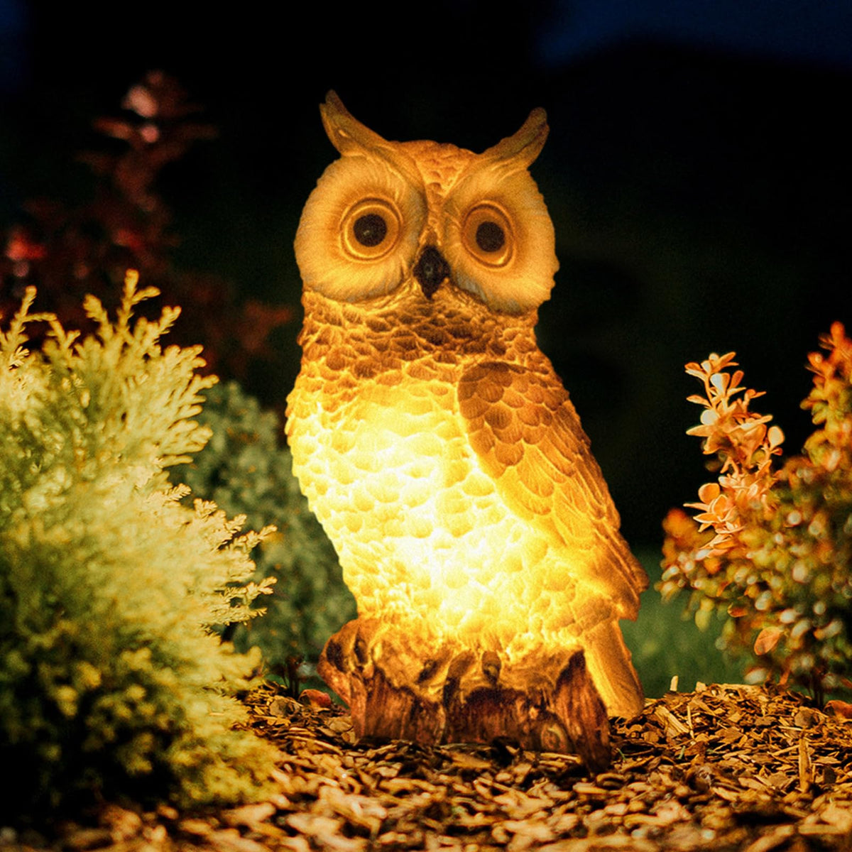 WONDHOME solar owl statue with LED lights for outdoor ambiance at dusk.