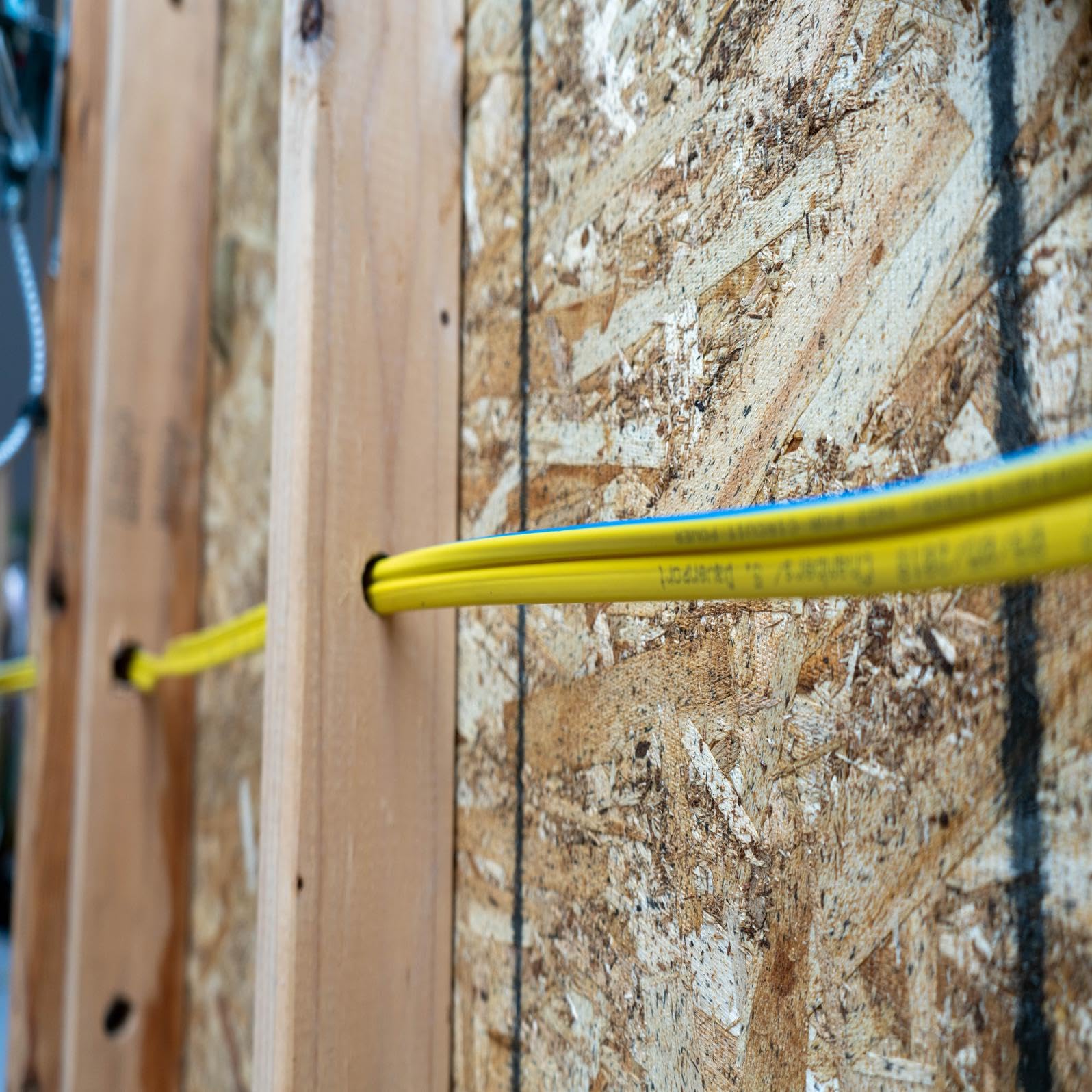 Close-up of Woods NM-B jacket showing durable insulation for indoor use