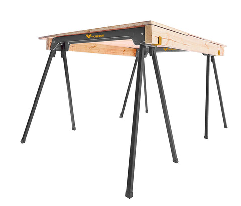 WORKESS setup beside a workshop bench offers versatile sawhorse use.