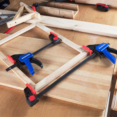 WORKPRO bar clamps in use on woodworking project.
