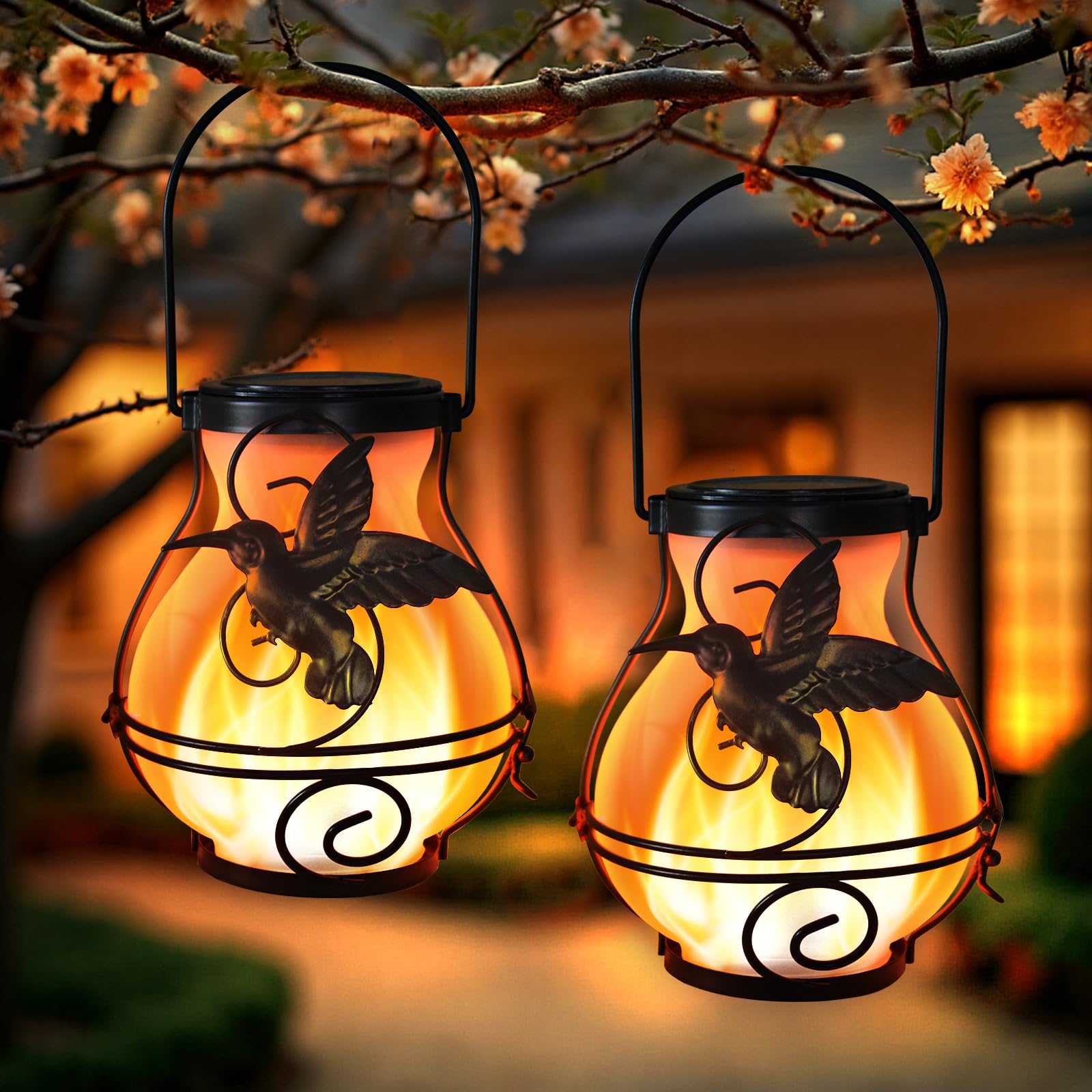 X-PREK hummingbird lantern with flickering flame provides warm garden ambiance.
