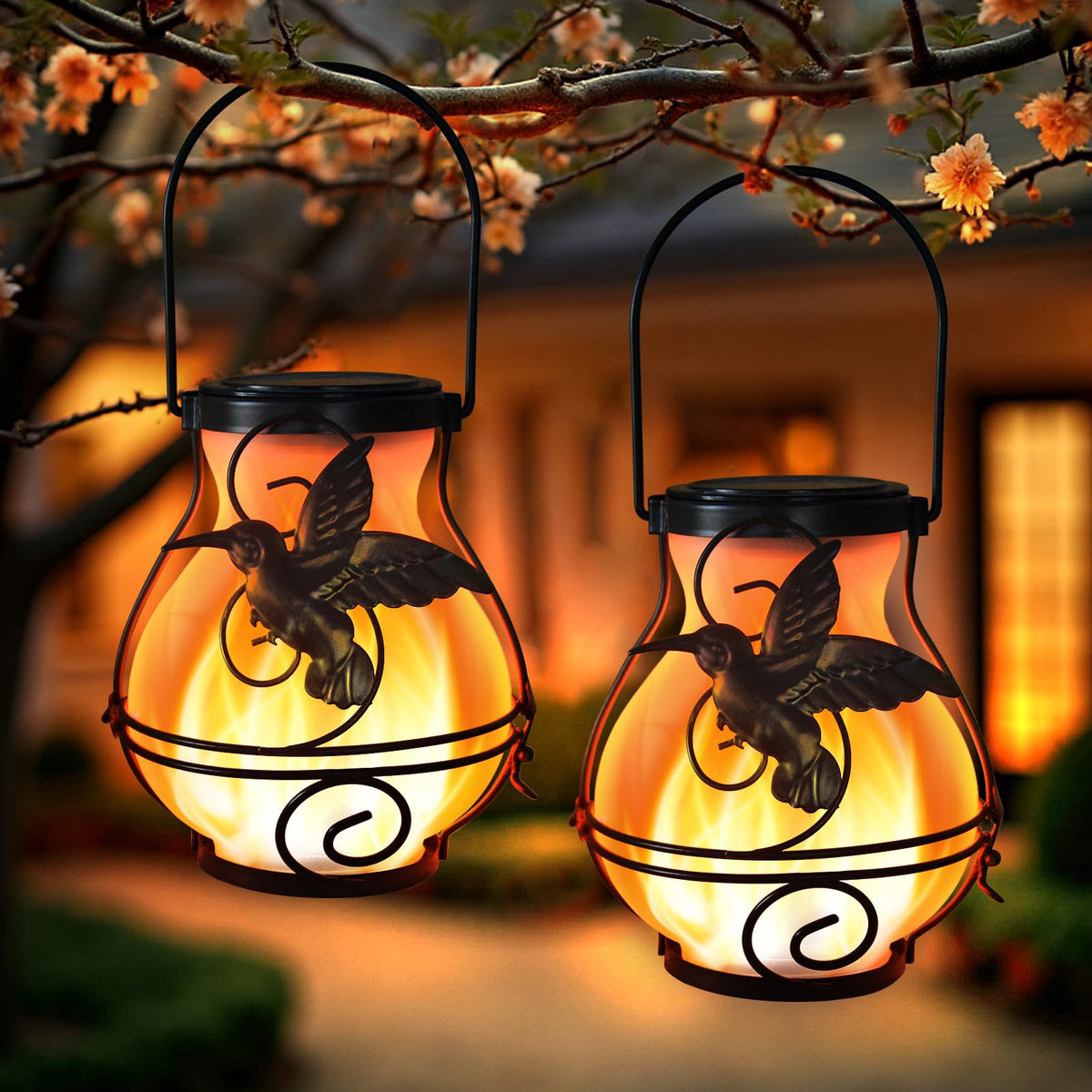 X-PREK hummingbird lantern with flickering flame provides warm garden ambiance.