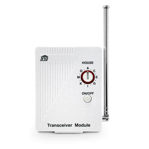 X10 TM751 wireless transceiver plugged into wall socket enabling remote lamp control.