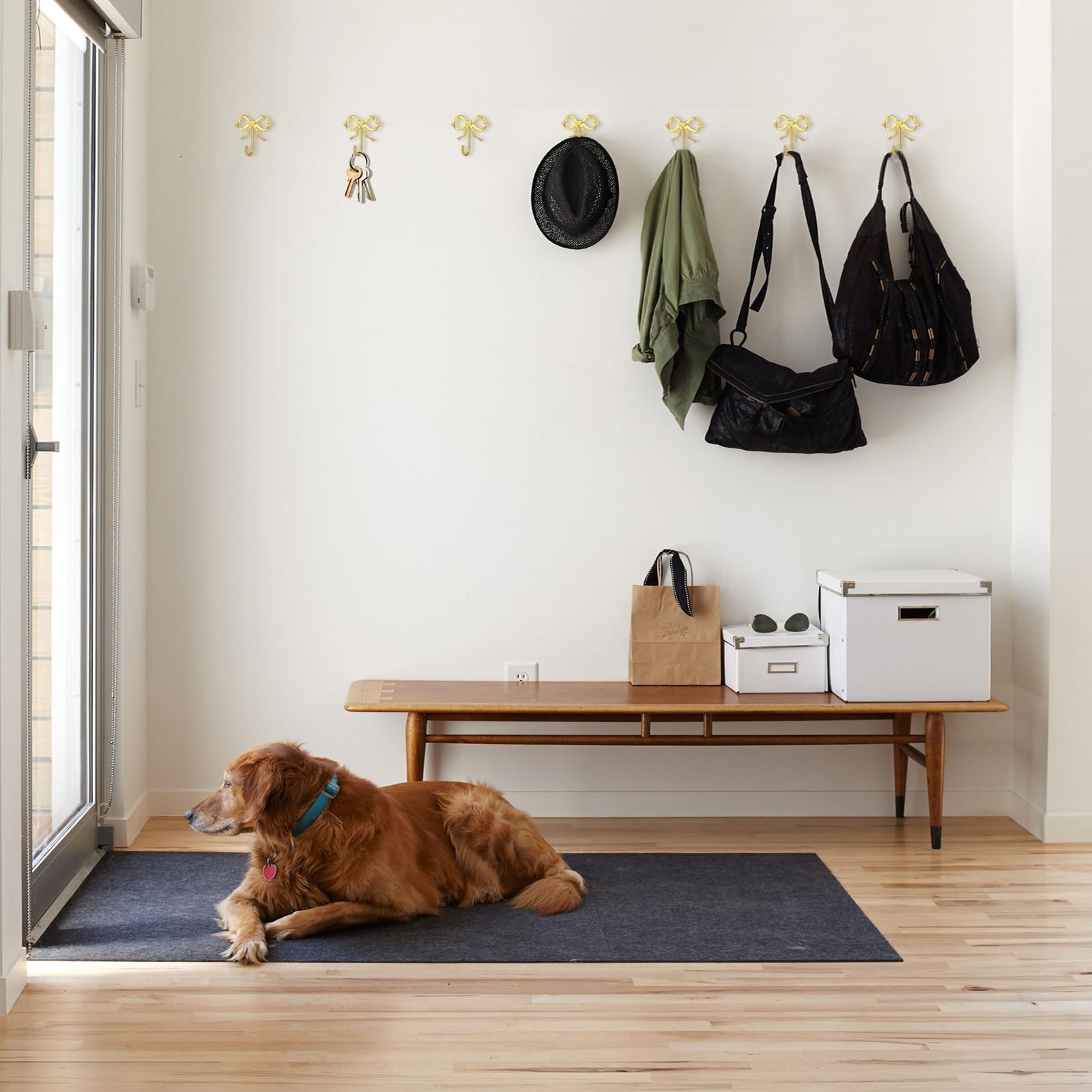 XHIPY gold bow wall hook hanging coats and mugs in a tidy kitchen or hallway