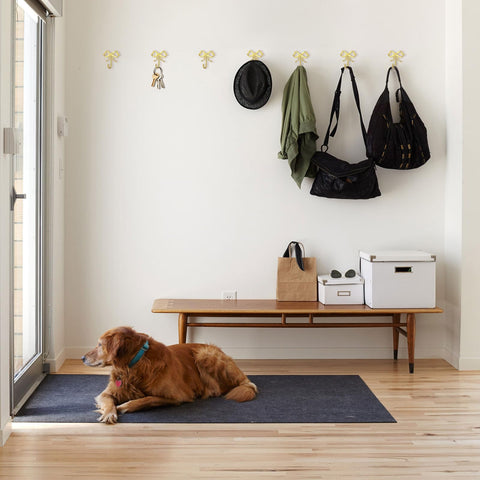 XHIPY gold bow wall hook hanging coats and mugs in a tidy kitchen or hallway