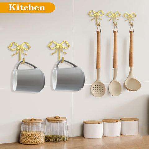 XHIPY gold bow wall hook mounted in entryway holds coats and bags securely