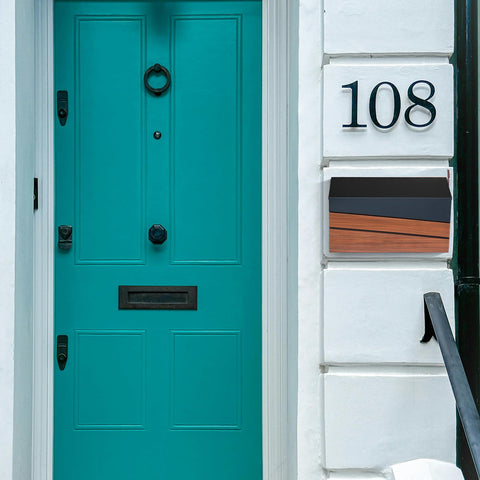 Xhlokk brushed metal surface mailbox blends with modern exteriors.