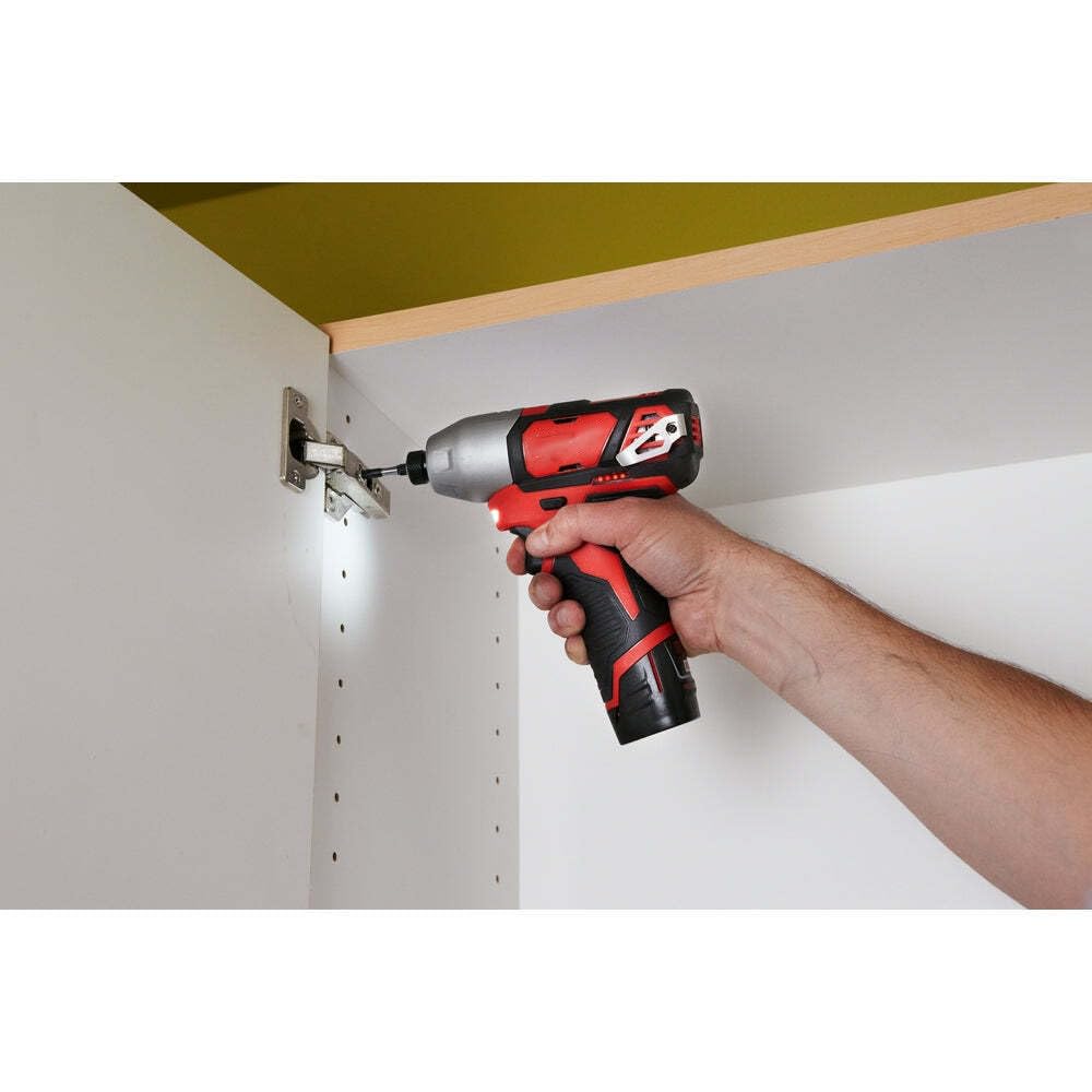 xiaomgu Milwaukee M12 hex driver in-use shot demonstrates hands-free belt clip practicality.
