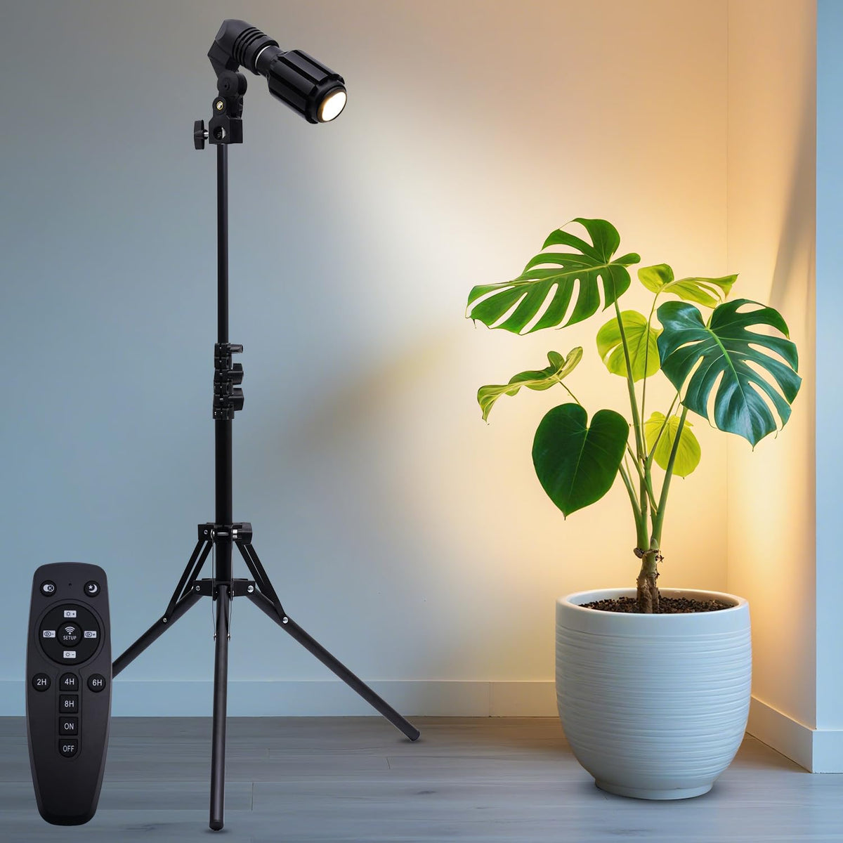 XINCLING indoor spotlight on extended tripod stand for tall greenery.