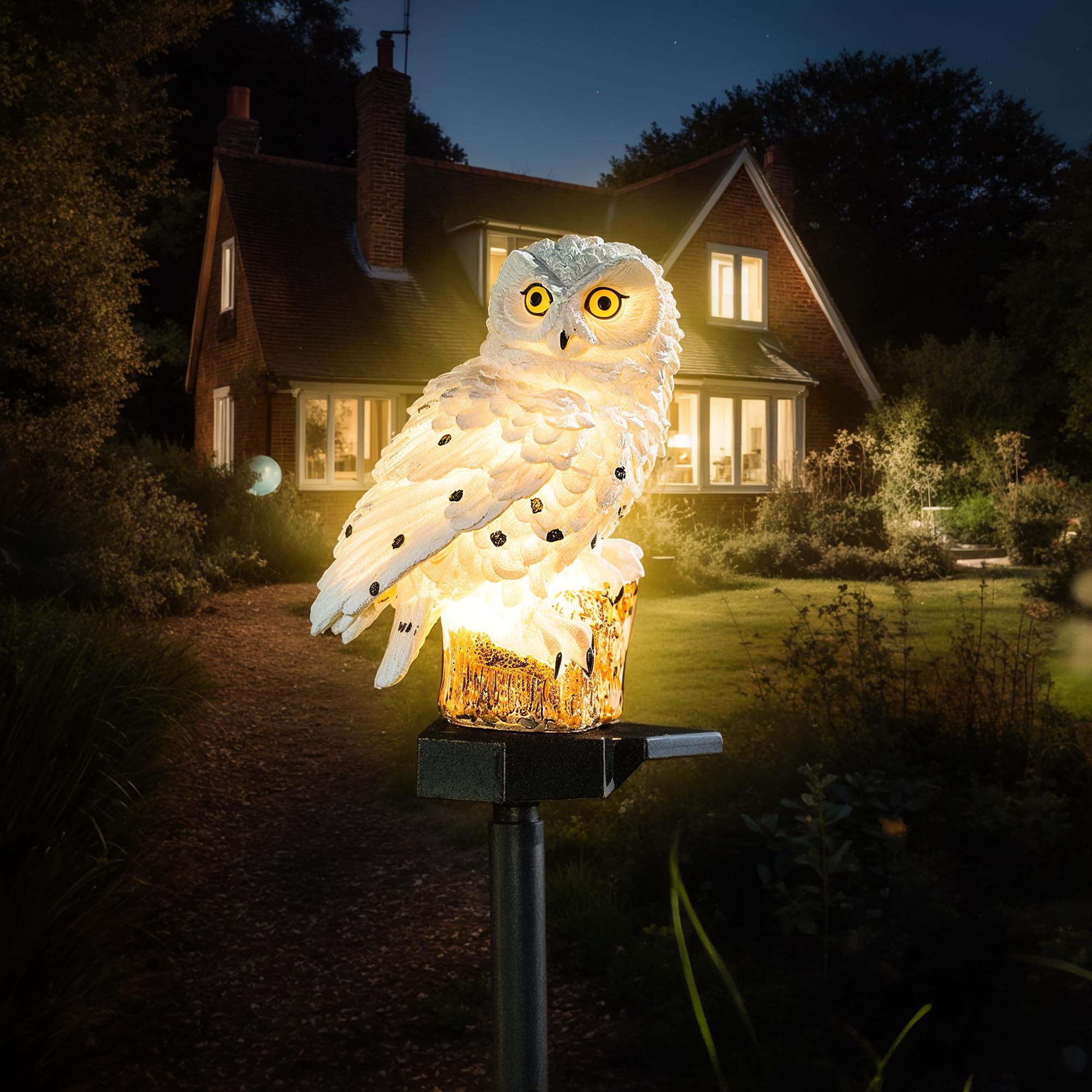 XURLEQ garden solar light: owl on a stake provides warm walkway illumination