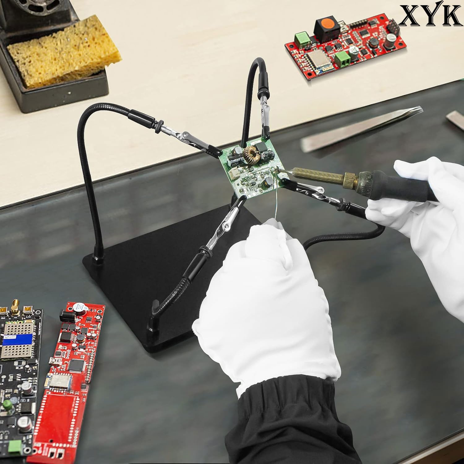 XYK Helping Hands on a tidy desk setup during a soldering task