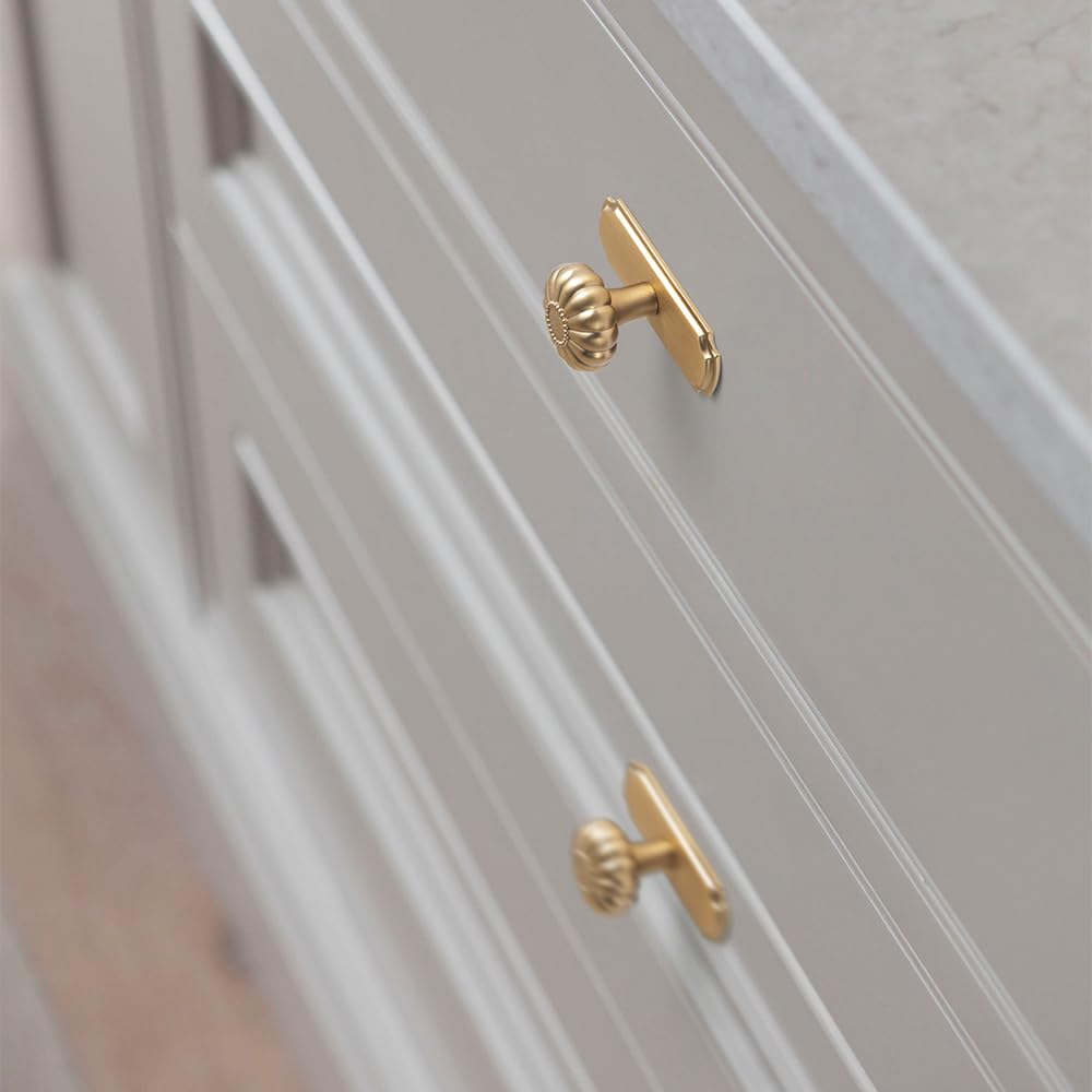 Yanxia champagne bronze finish on a knob for warm cabinet appeal.