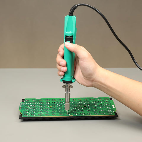 YIHUA 929D VI in-action on keyboard shows practical circuit board rework.