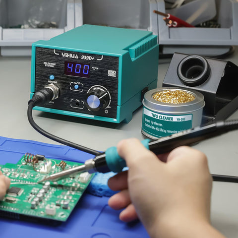 Soldering station with integrated power plug for convenience.