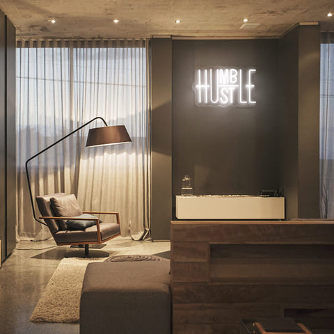 Closeup of the Hustle neon glow showing warm white light for cozy ambiance.