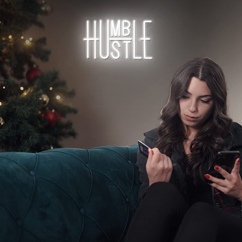 Office decor backdrop featuring the Hustle neon for a focused vibe.