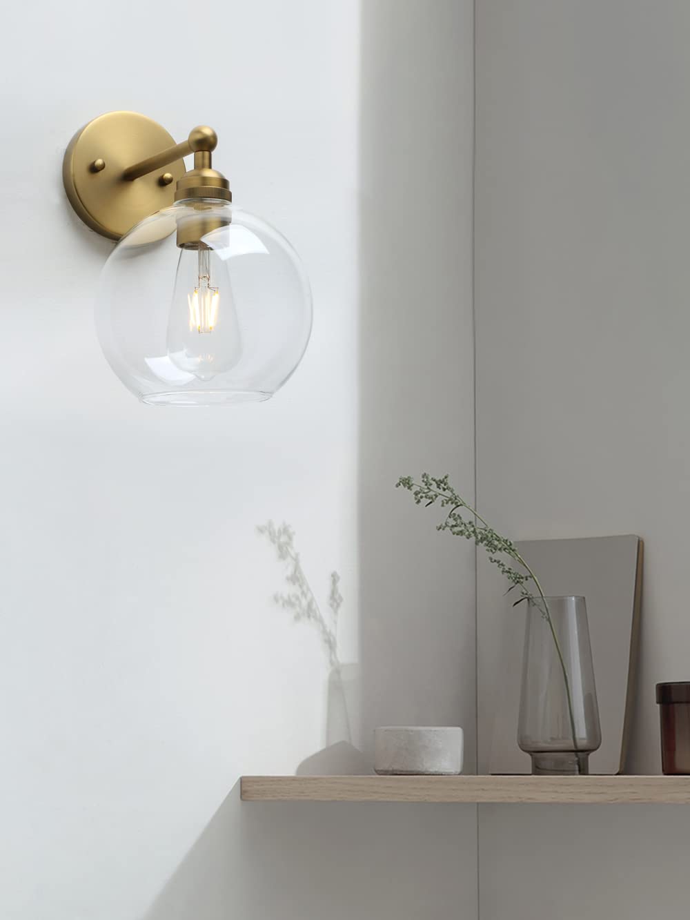 Yosoan vanity light above a mirror delivers ambient warmth and clarity.