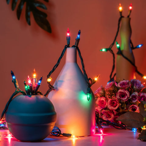 YULETIME lights highlighting a holiday porch display with multicolor hues