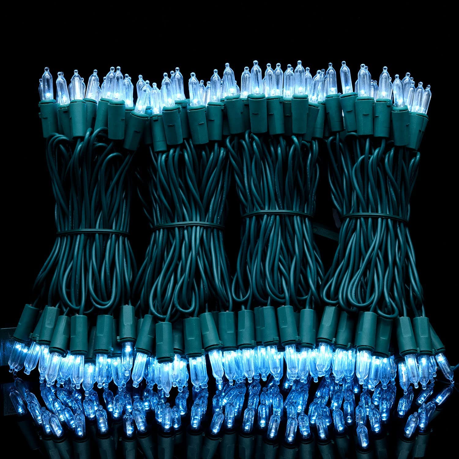 YULETIME cool white bulbs provide bright, steady illumination for trees and fences.