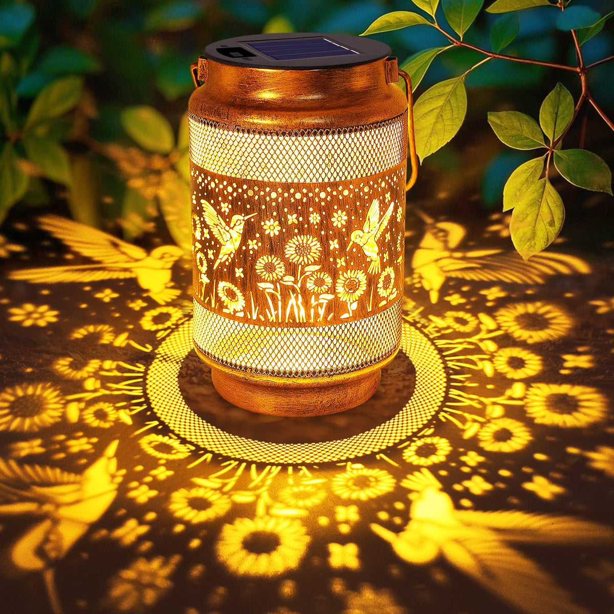 Yulloyello hummingbird lantern in gold bronze casts warm garden glow for patios at night.