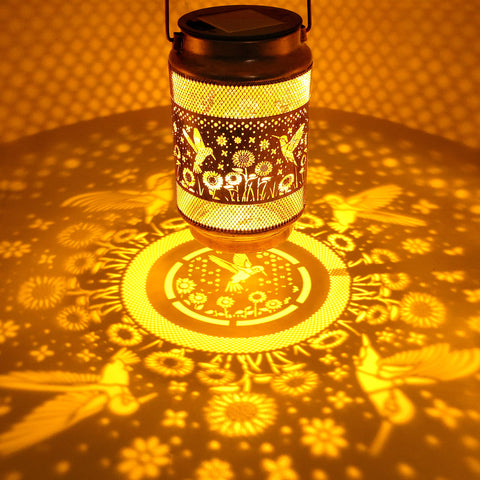 Yulloyello hummingbird-lantern openwork design creates charming light patterns along walkways.